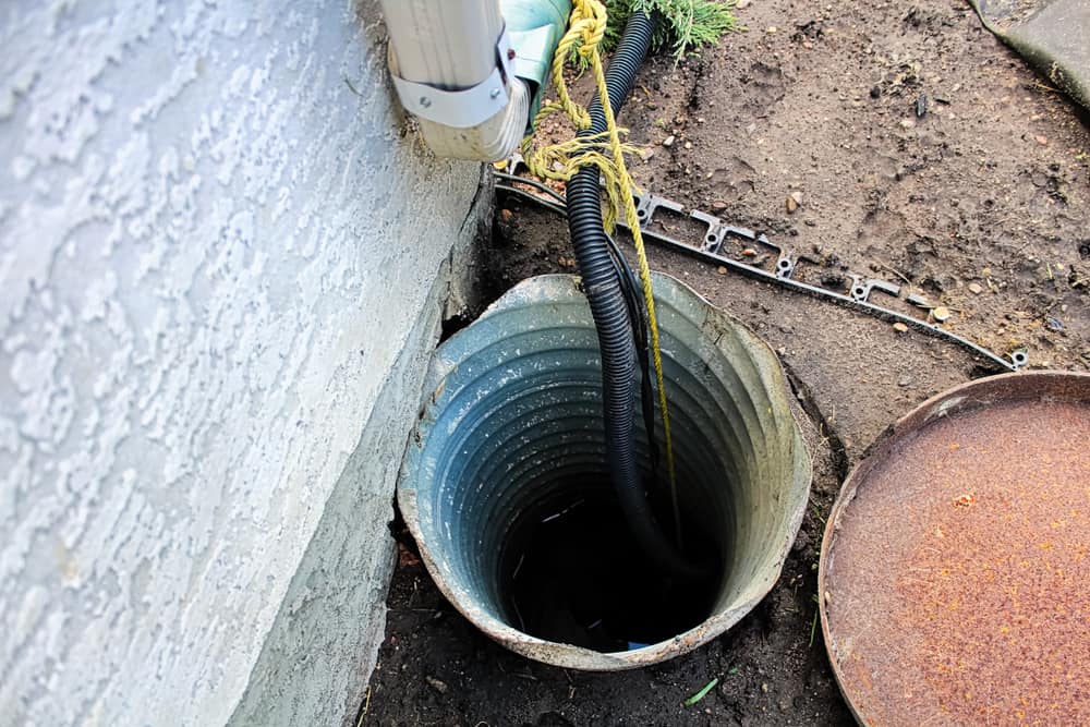 sump pump outside of a residential house.